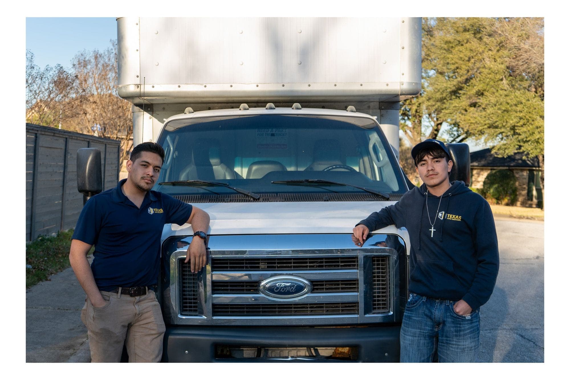 Erick and Jo from Texas Junk Brothers with their service truck in Dallas